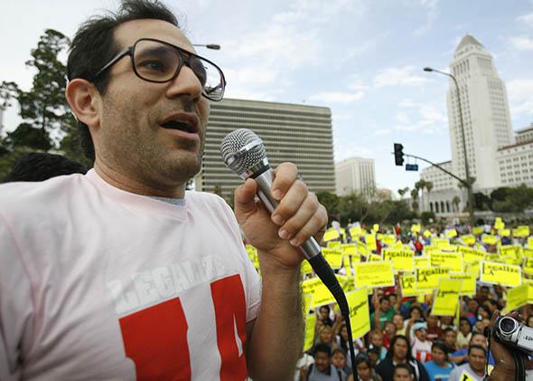 American Apparel owner Dov Charney speaks during a May Day rally protest march for immigrant rights.